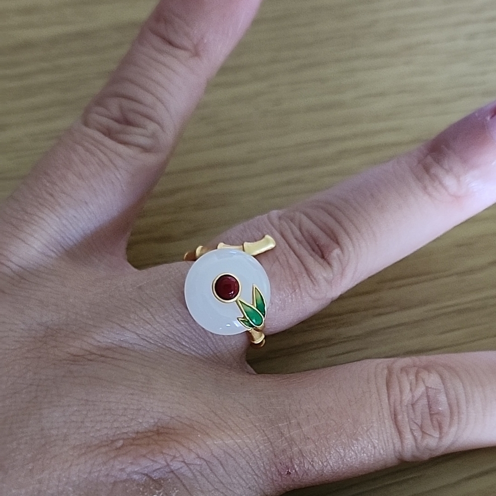 Elegant Gold and White Ring with Red Accent